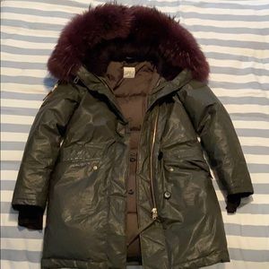 SAM down military parka with purple fur trim.